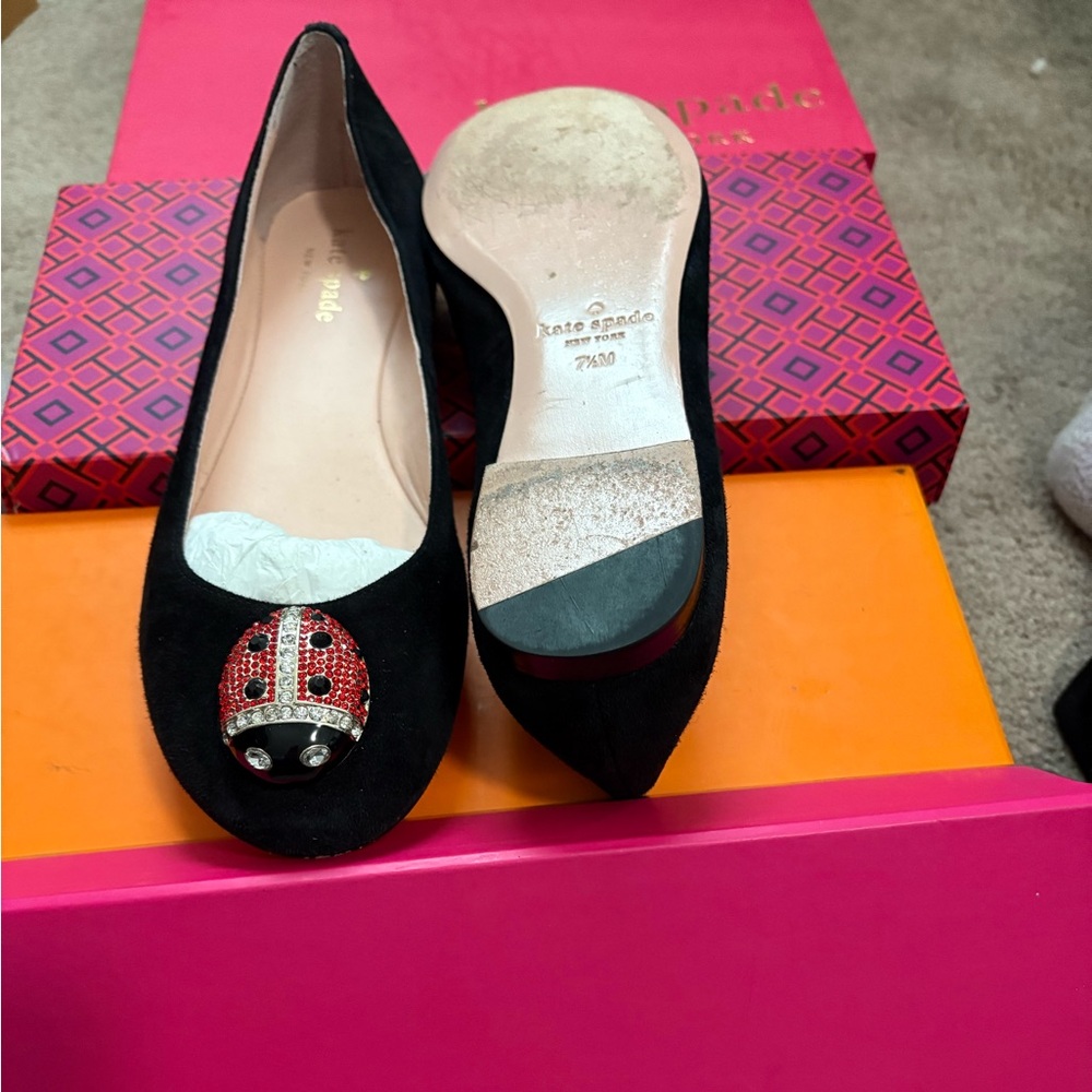 This is a pair of Kate Spade Leather flats with jeweled ladybug.